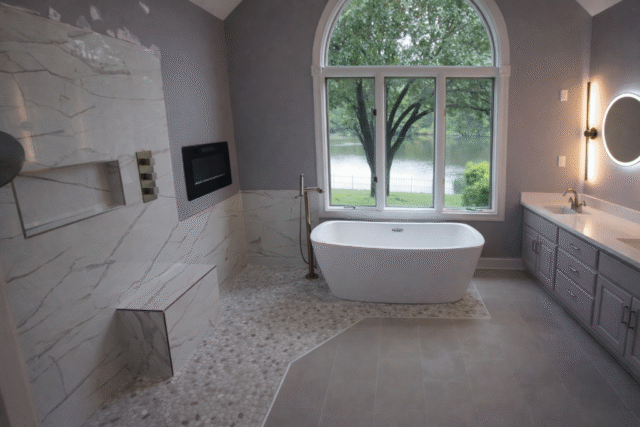 Custom master bathroom with freestanding tub and marble tile in Virginia Beach Virginia remodeling project