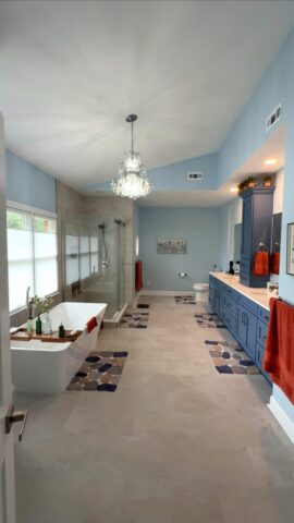 Spacious blue bathroom remodel with freestanding tub and custom double vanity in Virginia Beach VA