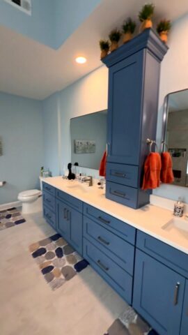 Blue shaker double vanity with quartz countertop in Virginia Beach VA bathroom remodel