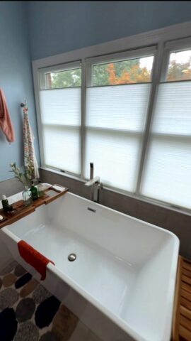 Modern freestanding bathtub near window in Virginia Beach Virginia bathroom remodel