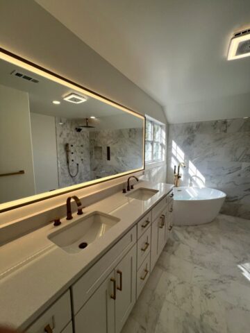 Custom double sink marble bathroom remodel in Chesapeake Virginia by Exclusive Kitchen & Bath