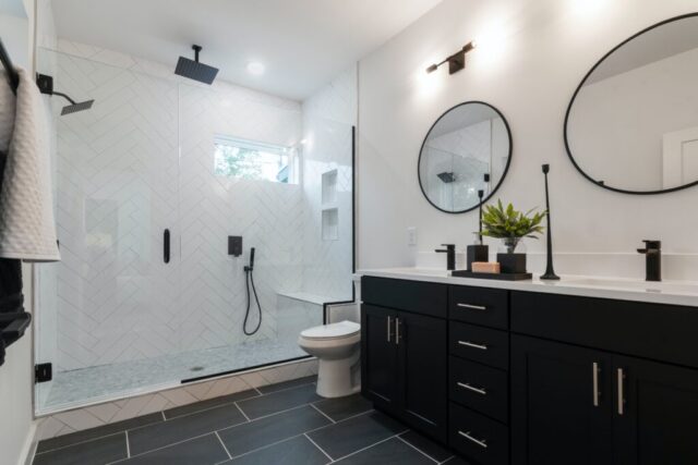 Contemporary bathroom with black vanity cabinet and gray tile inspiration