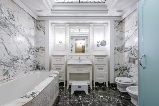 Traditional marble bathroom with double vanity and classic design inspiration