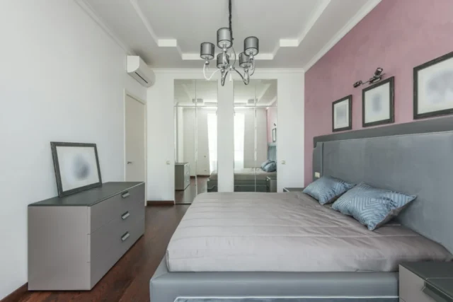 Luxury master bedroom with chandelier and soft color palette inspiration